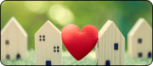 wooden houses with heart in between them