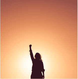 woman with hand raised in sunlight