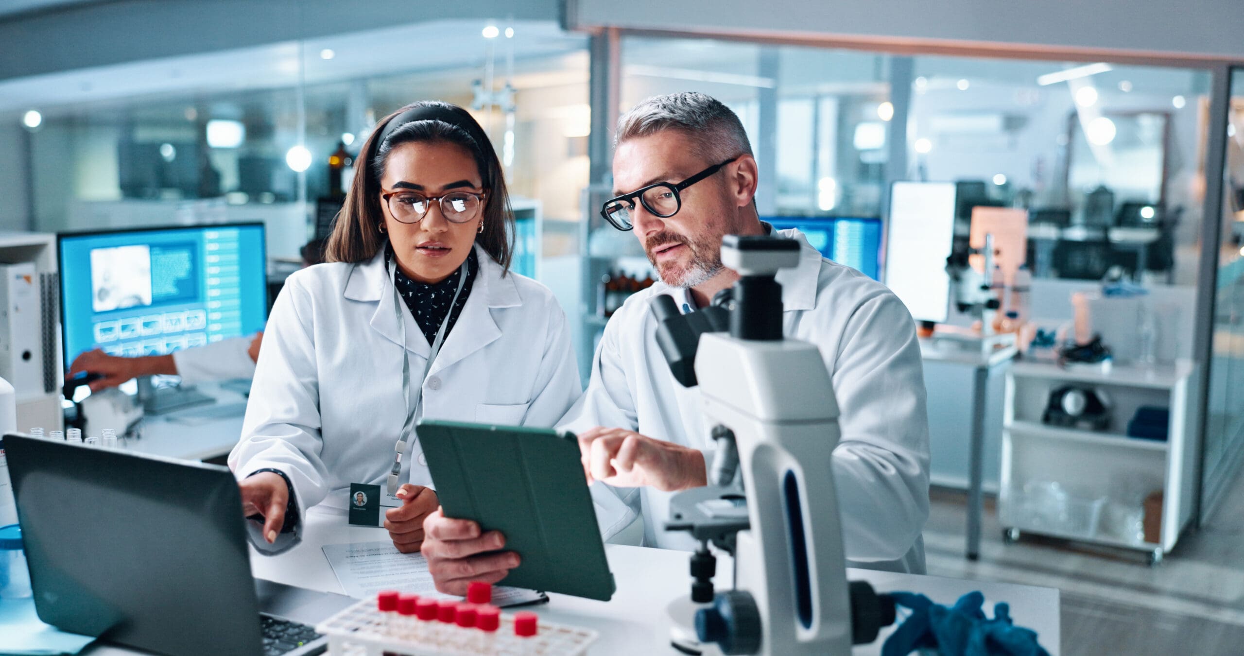 Two researchers collaborating in a lab.