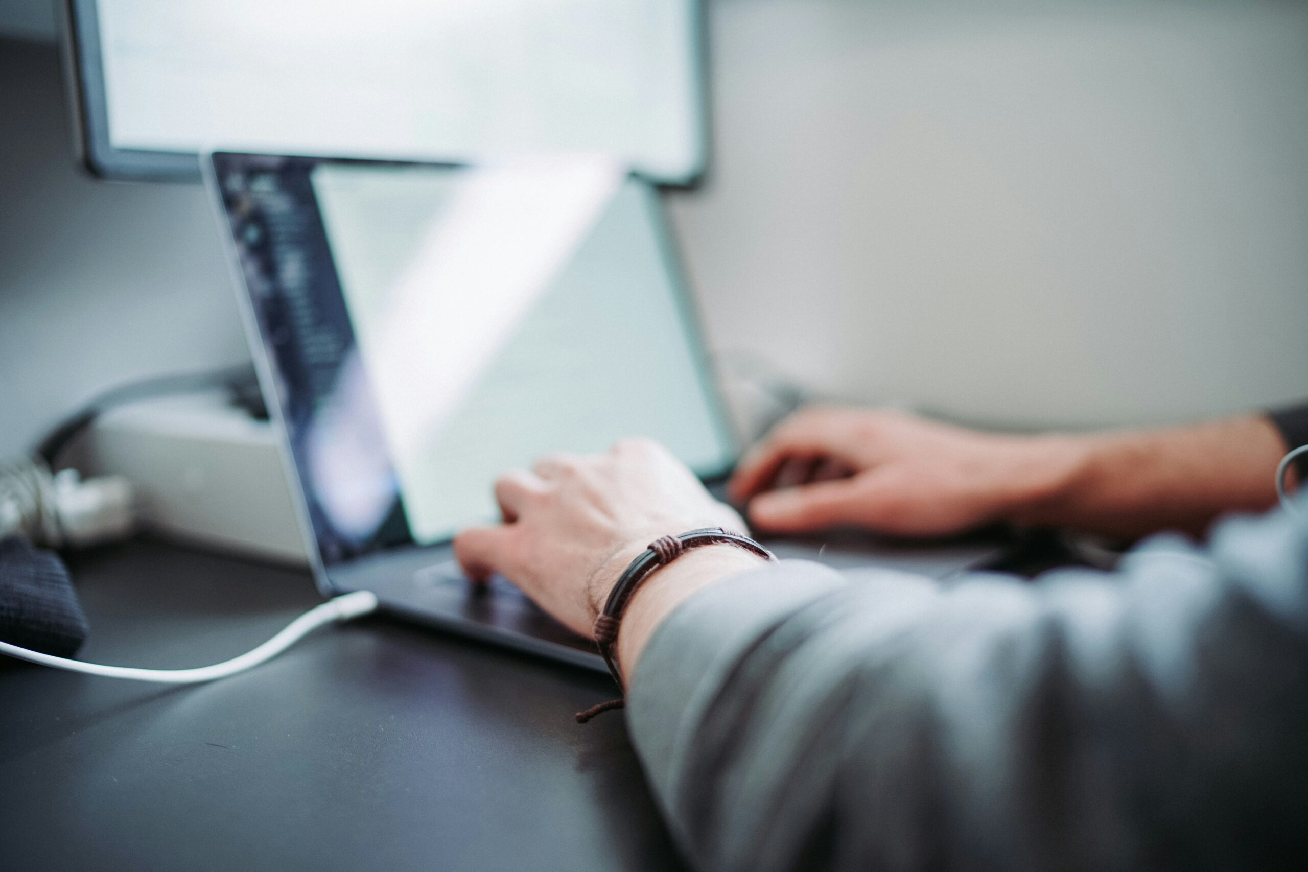 Person typing on laptop